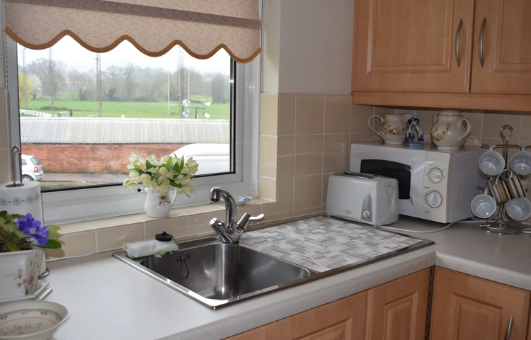 A kitchenette at Abbeyfield House, Weston-Super-Mare BS23 3BB